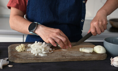 Close-Up Top View Of A Woman Cutting Onion