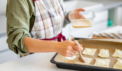 Close-Up Of Woman Baking Stuffed Cookies