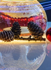 Christmas ball with Christmas decorations and pine cones
