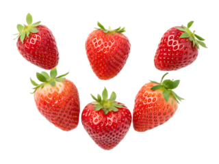 A group of six ripe strawberries with green stems arranged in a semi circle on a black background