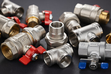 water ball valve with connecting fitting, on dark background,