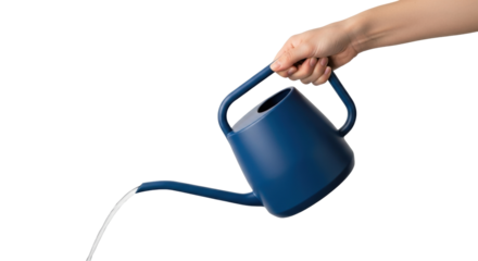 Isolated hand holding dark blue watering can pouring water, tool for gardening and landscaping