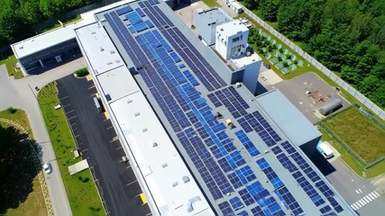 Aerial view of industrial complex with solar panels on the rooftops - Powered by Adobe