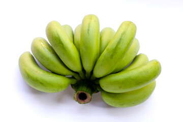 Unripe green bananas in a fresh cluster.
