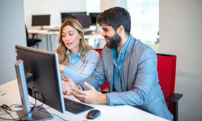 Colleagues working together on laptop