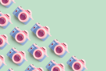 Pattern with SLR camera on pastel color background