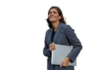 Business professional woman in suit walking and holding a laptop, expressing joy and career...