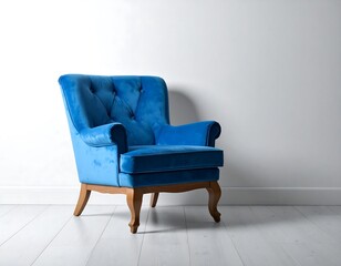 Blue velvet armchair against a white wall