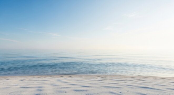 Calm ocean view with clear blue sky and sandy beach. - Powered by Adobe