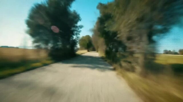 First person running on asphalt road surrounded by trees, suitable for promo videos, sports content, advertising material, personal blogs, fitness motivation.