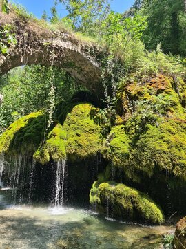 Waterfall Capelli di Venere, small mountainside cascade surrounded by vegetation, close to a ruined mill, Casaletto Spartano, Province of Salerno, Italy