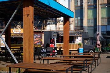Empty outdoor seating at food truck patio