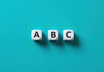 Three white dice with letters on a blue background