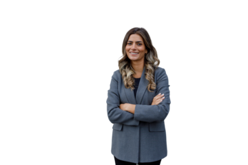 Professional young businesswoman smiling, standing with arms crossed, portraying confidence, leadership, and success on transparent background