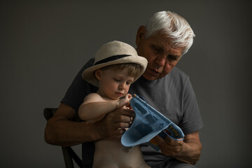 Portrait of Grandfather and Grandson in Soft Natural Light