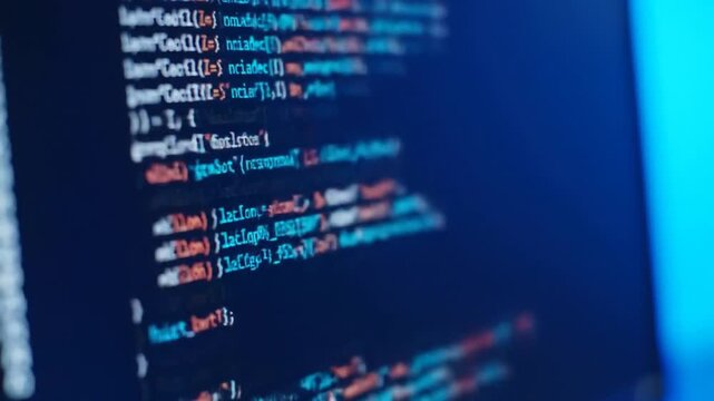 Close Up of Blue Computer Screen Displaying Complex Programming Code