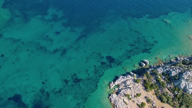 This stunning footage captures the serene beauty and natural landscape encountered on the journey to the ancient city of Knidos, located on the Dat&ccedil;a Peninsula in Turkey. Perfect for travel, nature, d