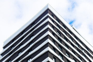 A modern business center with an elegant façade, clean lines, and contrasting colors. The building...