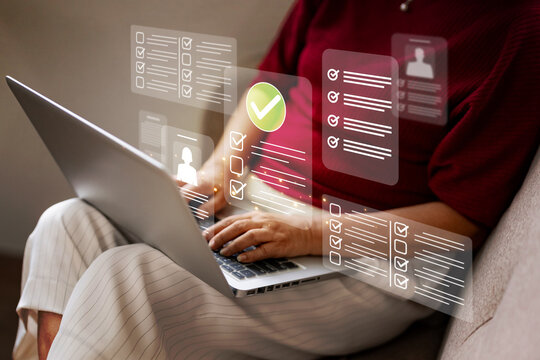 Person hands using laptop keyboard completing digital forms online checklists task management modern business process remote work solution data entry efficiency