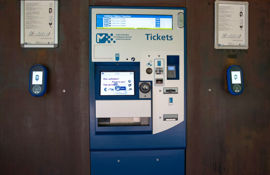 Alto Adige, Italy - July 03, 2025: Ticket vending machine with digital interface for public transportation in urban environment with modern design