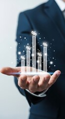 Business professional holding glowing rising bar graph symbolizing financial growth and success with digital data and technology