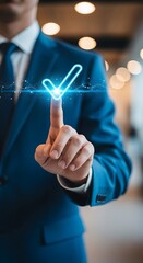 Businessman's finger touches glowing checkmark symbol for success and digital future technology concept