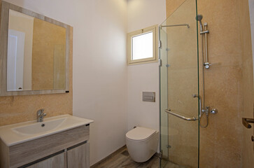 Modern bathroom in apartment with sink and shower