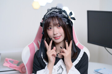 A Japanese woman in Lolita fashion posing from the camera's point of view