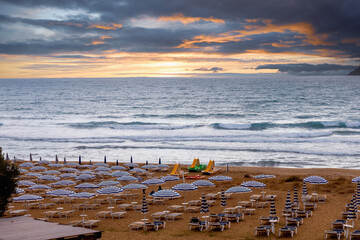 Scenic evening Mediterranean coast with golden sand