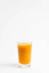 A Glass Of Orange Juice On A White Background