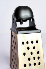 A Grater Metal On A White Background