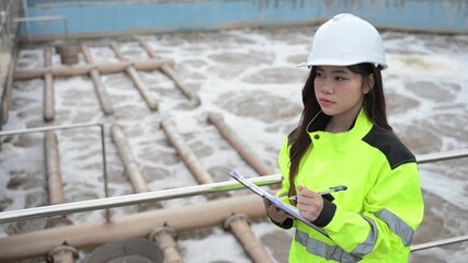 Engineer inspecting wastewater treatment plant and recording data for environmental monitoring. Concept of water management, industrial inspection, and sustainability process. - Powered by Adobe