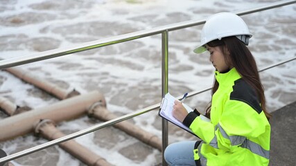Engineer inspecting wastewater treatment plant and recording data for environmental monitoring. Concept of water management, industrial inspection, and sustainability process. - Powered by Adobe