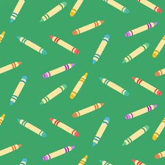Seamless hand drawn pattern of colorful crayons scattered on green background. Concept of creativity, childhood, school supplies and artistic expression