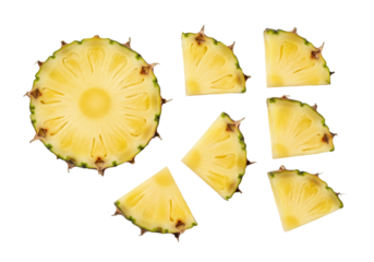 Bright yellow pineapple slices, including one large cross-section and juicy wedges with green rind, isolated on a pristine transparent background, top-down flat lay concept of tropical fruit freshness