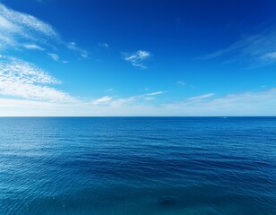 Obraz premium a serene view of a calm ocean under a clear blue sky evoking tranquility and peace
