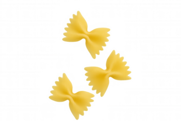 Farfalle pasta bow ties, dry uncooked italian food ingredient, yellow carbohydrate on transparent background
