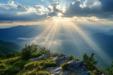 Divine light illuminating a serene mountaintop, showcasing nature's breathtaking beauty with sun rays piercing through clouds.