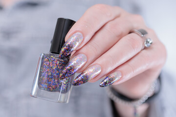 Female hands with long nails and white and black thermo french manicure