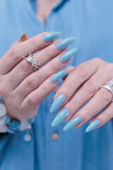 Silver dragon ring in woman's hands