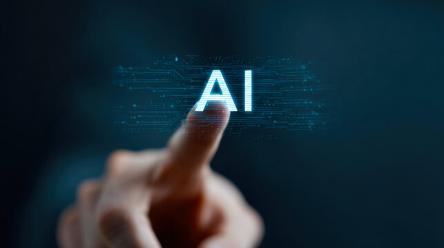 A hand is pointing to the word AI on a screen