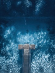 Pier Extending into Deep Blue Water, Aerial View, Tranquil Scene.