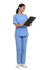 Nurse in uniform writing on clipboard against white background