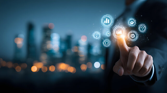 Displaying a digital interface with glowing icons, a person's fingertip interacts with the technology, showcasing concepts of innovation and modern advancement against a blurred cityscape backdrop...