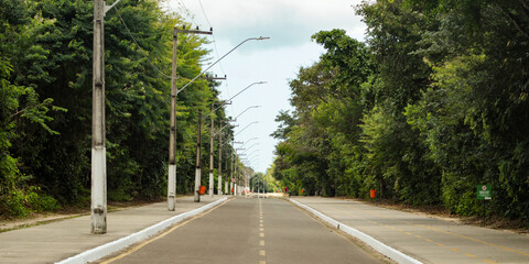 Many trees and a track for running and walking in Itapiracó Park, in São Luis, Maranhão, Brazil.