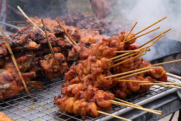 Marinated meat with sauce and spices Many flavorings Bamboo skewers grilled with charcoal