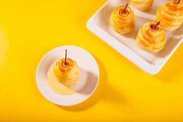 Pears in puff pastry dough drizzled with honey. Healthy and organic food.
