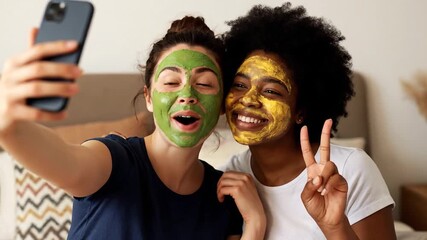 Friends taking a selfie while enjoying a spa day with face masks.