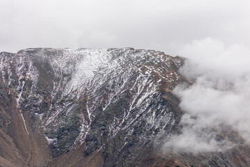 A tranquil fog layer adds mystery to the rugged landscape near Vail.
