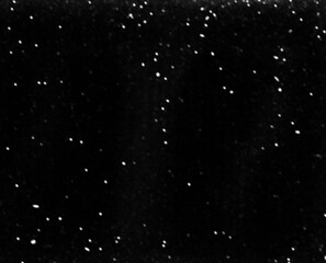 Minimal blurred snow overlay on dark, black background. Subtle motion particle texture ideal for adding gentle winter mood. Good to use as photo overlay. Snowfall. Abstract unfocused background